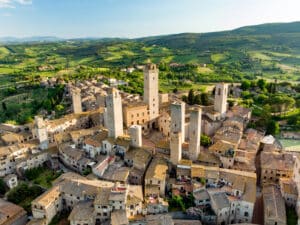 Aerial view of famous medieval San Gimignano hill town including the stone Torre Grossa.