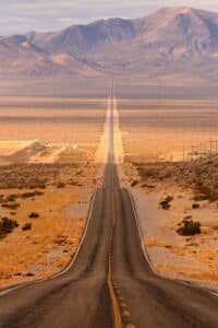 Long desert highway leading into Death Valley National Park from Beatty, Nevada