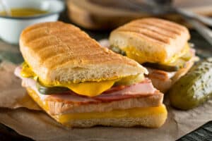 Pressed Cuban sandwich with pickles—classic Miami ballpark bite
