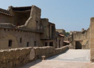 Quiet Roman street with surviving upper floors.