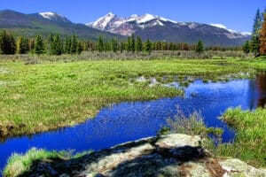 Rocky Mountain Scenic Panorama and River Landscape.