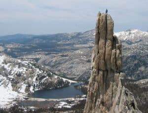 Top of the Worlds. Climber on top of Cathedral Peak in Tuolumne Meadows, Yosemite