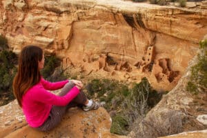 Tourist admiring Square Tower House, Mesa Verde National Park