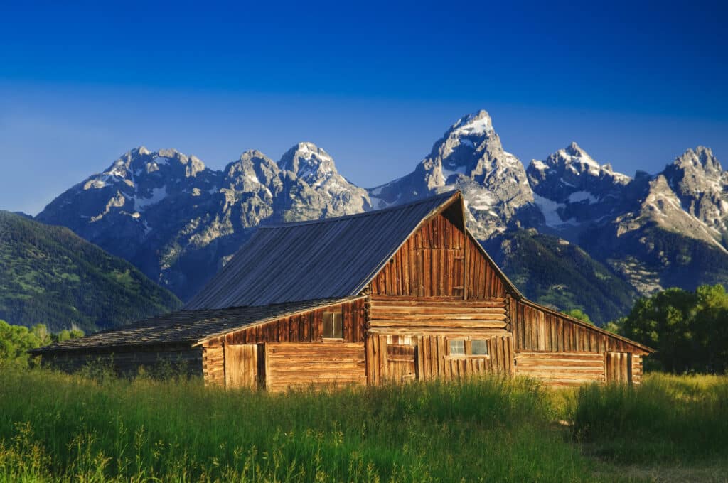 The Moulton Barn and the Teton Mountain Range in Grand Teton National Park, Wyoming.