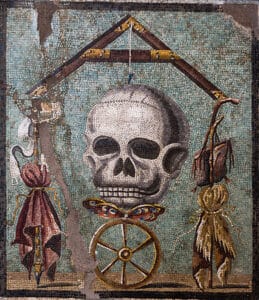 Memento Mori mosaic (opus vermiculatum emblema), from a house‑workshop (I,5,2) at Pompeii, 1st century BC; polychrome tesserae, 47 × 41 cm. Collection: National Archaeological Museum, Naples (MANN), inv. 109982.